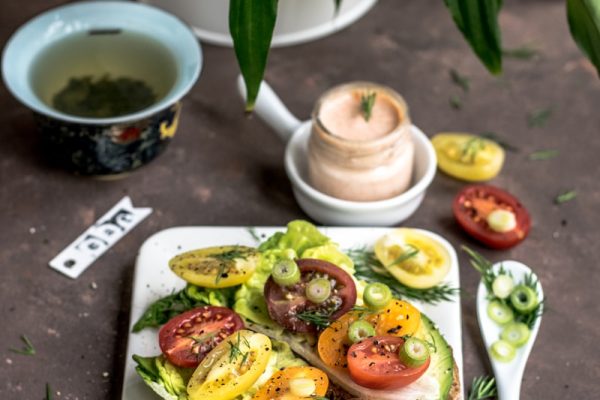 cooked food with slice vegetables on white ceramic plate